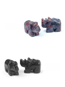 Detailed stone carvings of rhinos in sesame stone and obsidian with polished textures
