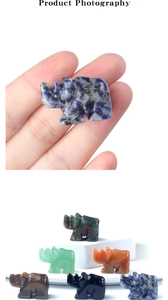 Macro view of hand-carved natural stone rhinoceros figurines in various gemstones