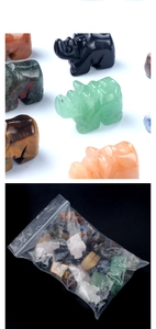 Macro detail of hand-carved crystal rhino figurines in diverse natural gemstones