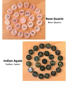 Macro shot of polished Rose Quartz and Indian Agate Runes with gold engraved symbols