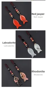 Detailed view of hand-woven fish pendants in Red Jasper, Labradorite and Rhodonite stone