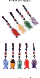Detail view of hand-woven fish pendant keychain made from various natural crystal gemstones
