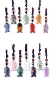 Detailed collection of hand-carved crystal fish pendants with braided ropes and wooden beads