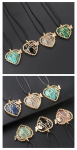 Détails du pendentif arbre de vie en forme de cœur avec fil doré et papillon ciselé