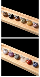 Macro detail of assorted 25mm gemstone apples with rhinestone metal leaves