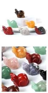 Detailed view of hand-carved crystal rabbit figurines in various natural gemstones