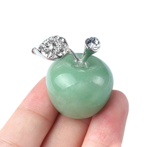 Green crystal apple miniature decor with silver leaves and rhinestones held in hand