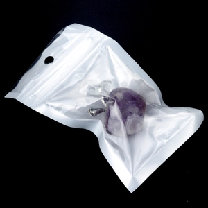 Handcrafted purple amethyst crystal apple sculpture with silver leaf in a clear retail pouch