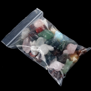 Bulk set of assorted crystal snail and animal stone carvings in a clear package