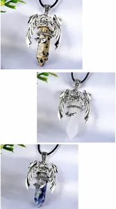 Detailed view of dragon wrap pendants with Dalmatian Jasper, Clear Quartz, and Blue Spot stones