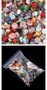 Close-up of polished colorful round crystal and agate stones in flat cylindrical shape