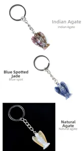 Detail view of angel charms in Indian agate, blue spot jade, and natural agate stone