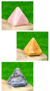 Detailed view of Rose Quartz, Yellow Jade and Sodalite crystal pyramid ornaments