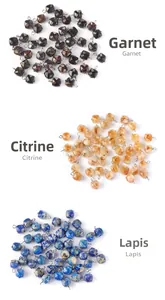 Detailed macro of faceted garnet citrine and lapis lazuli pendants with metal hooks