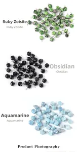 Macro view of faceted square crystal beads in Ruby Zoisite, Obsidian and Aquamarine stones
