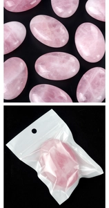 Detailed view of polished natural rose crystal stones with smooth surface and oval shape