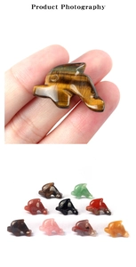 Macro shot of 1-inch hand-carved natural gemstone dolphins in various crystal materials