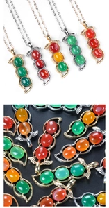 Detailed macro view of four-season bean jade pendants with vibrant multi-colored stones