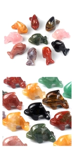 Macro detail of various polished natural gemstone dolphin figurines with smooth stone texture