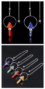 Macro detail of natural amethyst and quartz hexagonal energy pendants with silver chains
