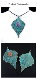 Macro view of vintage alloy maple leaf pendant with amethyst and pyrite stones