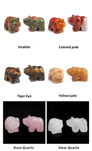 Macro detail of various natural crystal bear carvings showing texture and stone colors