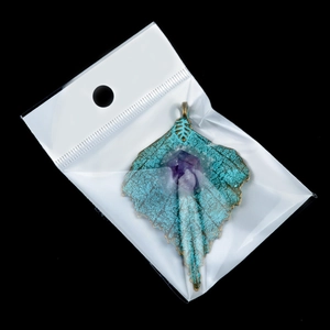 Vintage maple leaf alloy pendant with purple amethyst gemstone in clear packaging