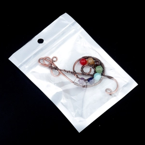 Handmade copper wire wrapped treble clef pendant with seven chakra energy gemstones