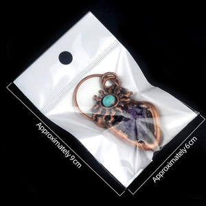 Vintage bronze sun necklace with amethyst pendant and turquoise inlay in packaging