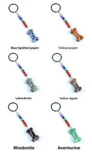 Detail of six natural stone bone keychains featuring Labradorite and Indian Agate crystals