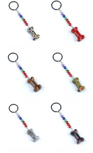 Detail of diverse 35mm natural stone bone keychains with chakra beads and metal rings