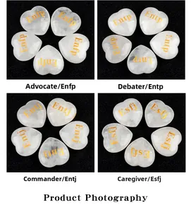 Macro detail of heart-shaped white crystal stones with gold engraved MBTI personality types