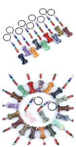 Detailed view of bone-shaped natural crystal pendants with colorful beads and keyrings