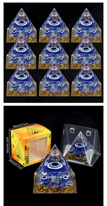 Detailed macro view of Evil Eye Orgonite Pyramid with Lapis Lazuli and gold foil
