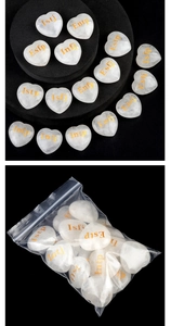 Macro shot of heart-shaped white crystal with golden MBTI personality type engraving