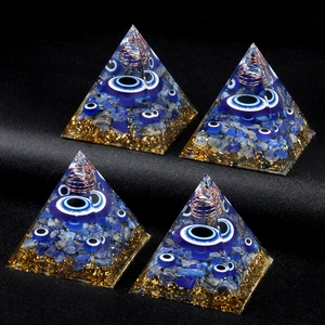 Orgone energy pyramid with evil eye beads and lapis lazuli stones for home decor