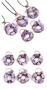 Macro view of vintage amethyst doughnut pendants with raw crystal cluster and copper trim