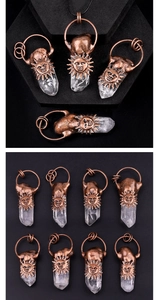 Macro view of vintage bronze sunface pendant with white quartz crystal column and rustic weld