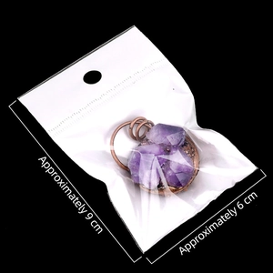 Colgante de amatista natural vintage con borde de cobre en empaque transparente