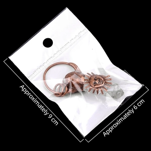 Vintage bronze sunflower pendant with pale green quartz crystal on black background