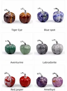 Detailed view of various pumpkin-shaped gemstones like Tiger Eye and Amethyst decor