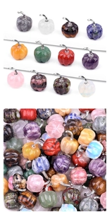 Close-up of assorted gemstone pumpkin pendants with silver-toned metal top hooks