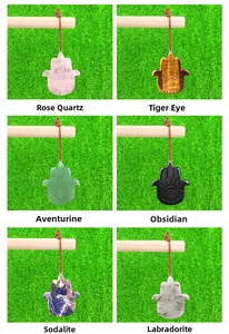 Hamsa hand pendants crafted from natural amethyst, rose quartz, and assorted gemstones