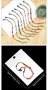 Detailed view of handmade beaded bracelets in retail packaging with size dimensions