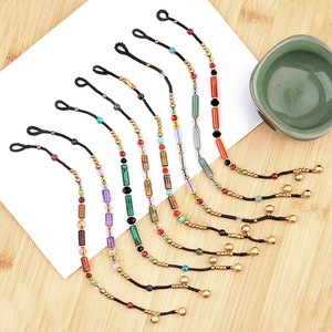 9-piece set of handmade bohemian crystal bead bracelets with small golden bells