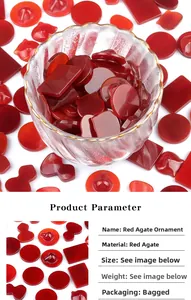 Various shapes of red agate stones for DIY jewelry making in a decorative glass bowl