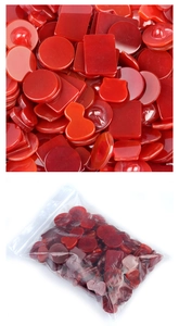 Macro detail of red agate stones in round and gourd shapes for DIY jewelry making