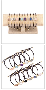 Detail view of adjustable rectangular natural stone bracelets in various gemstones