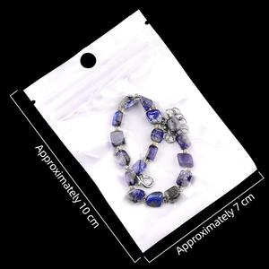 Natural Lapis Lazuli irregular beaded bracelet with silver lobster clasp on black background