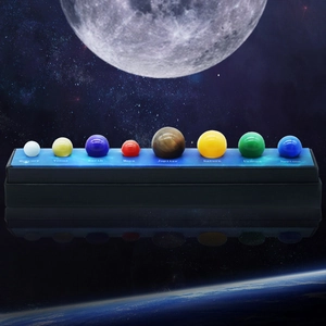 Educational solar system set featuring eight planet gemstone spheres on a black display base